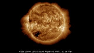 golden yellow sun with a large dark patch in the lower left corner, this is a coronal hole which could bring fast solar wind when it turns to face earth in the coming days.