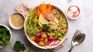 Bowl of salad and pickled vegetables with quinoa