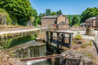 Cromford Mill, at the world's first water-powered cotton spinning mill developed by Richard Arkwright in 1771 in Cromford, Derbyshire.