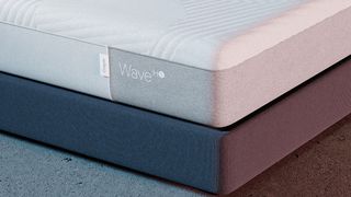 Casper Wave Hybrid Snow mattress review: image shows a corner of the grey and white mattress with the Casper logo on display