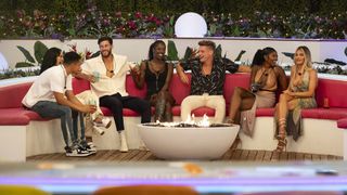 Love Island Games cast members sitting on the couch in Love Island Games