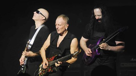 Joe Satriani, Phil Collen and John Petrucci jamming on stage in New York