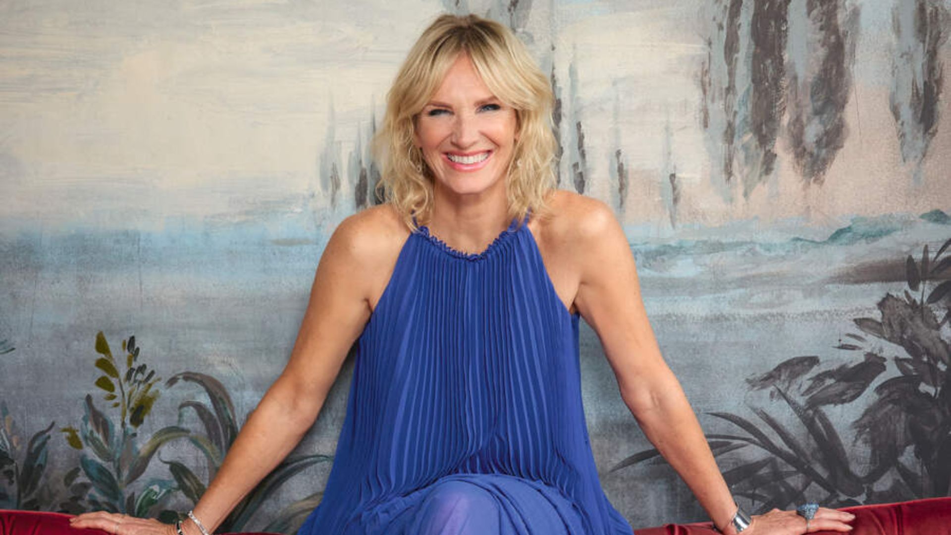 Jo Whiley wears a blue dress 