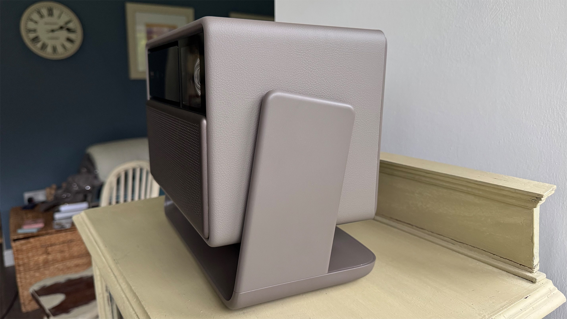 Xgimi Horizon 20 Max home cinema projector on wooden furniture viewed from side