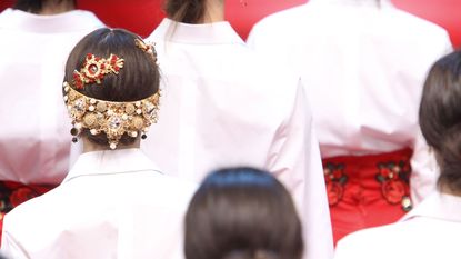 Hairstyle, Headgear, Tradition, Fashion accessory, Costume accessory, Fashion, Temple, Ceremony, Headpiece, Hair accessory, 