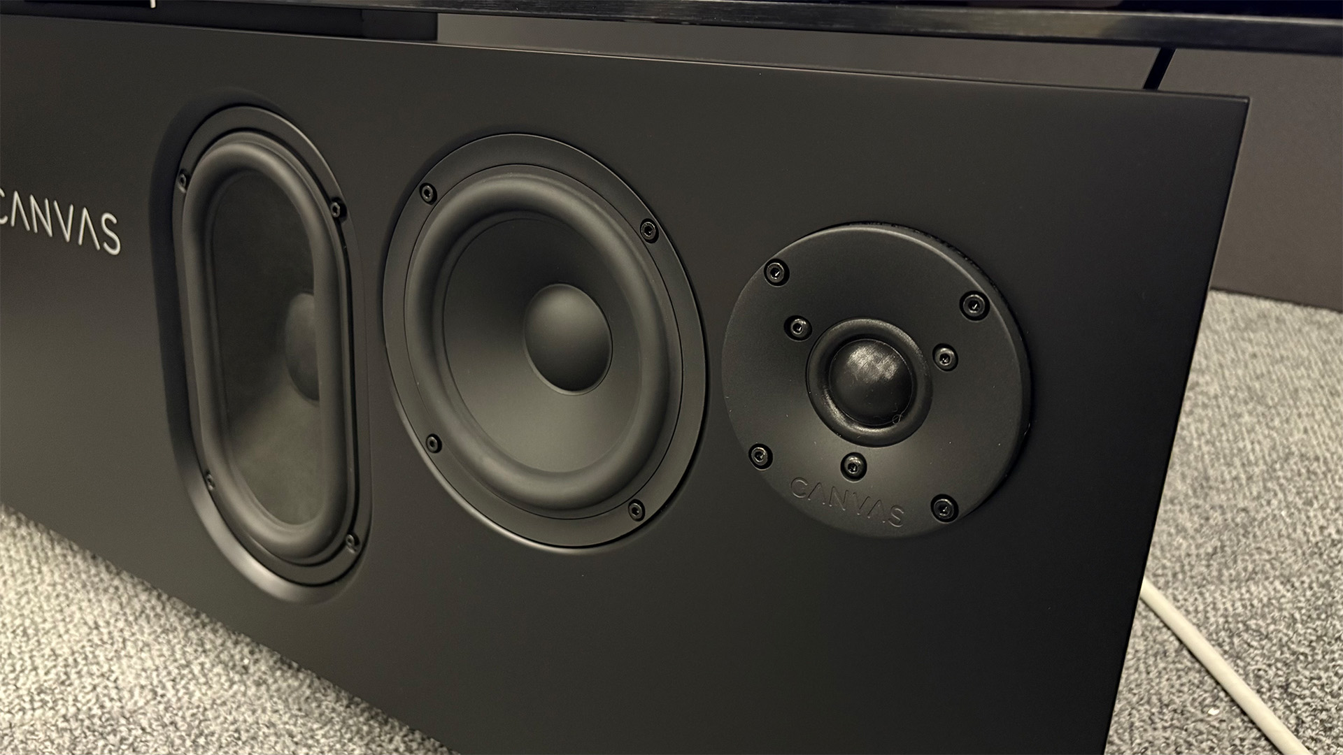 Canvas Hifi 65 soundbar on grey carpet close up of drivers