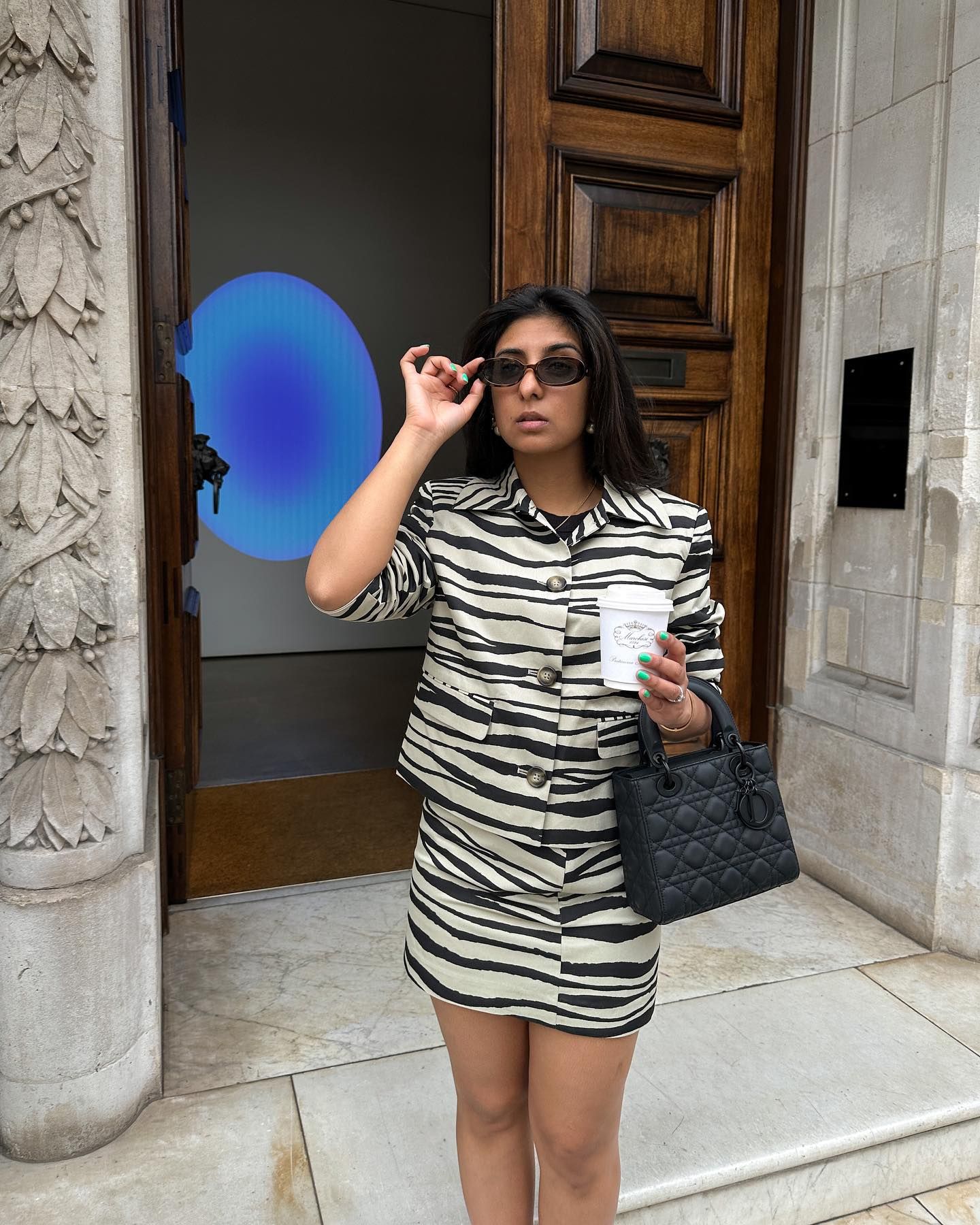 A picture of the best skirts for petites, as styled on @shloka