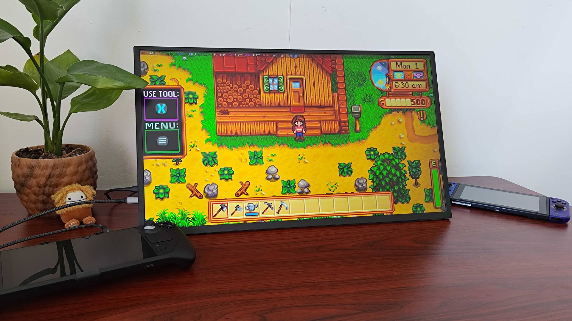 Uperfect Umax 24 portable monitor on desk with Steam Deck connected running Stardew Valley.