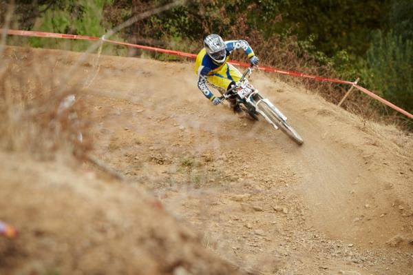 U19 Womens Downhill Winner Emily Hockey rounding the berm