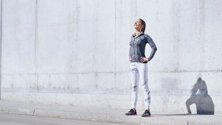 Female jogger enjoying sunny day during urban workout