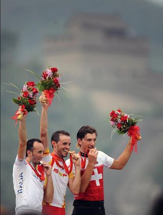 Fabian Cancellara, right, received today the silver medal originally awarded to Davide Rebellin, left, who was disqualified for doping.