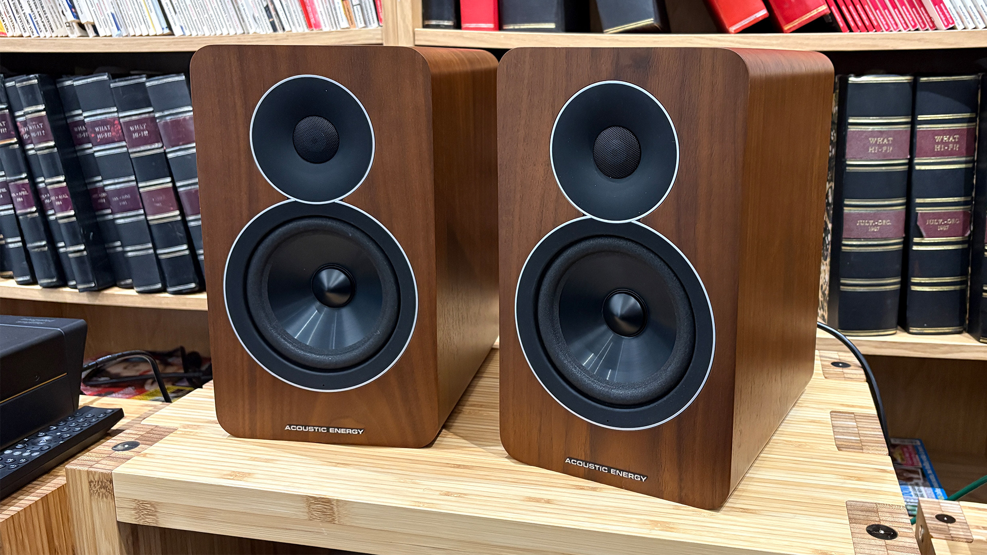 Acoustic Energy AE Active speakers on a wooden hi-fi rack