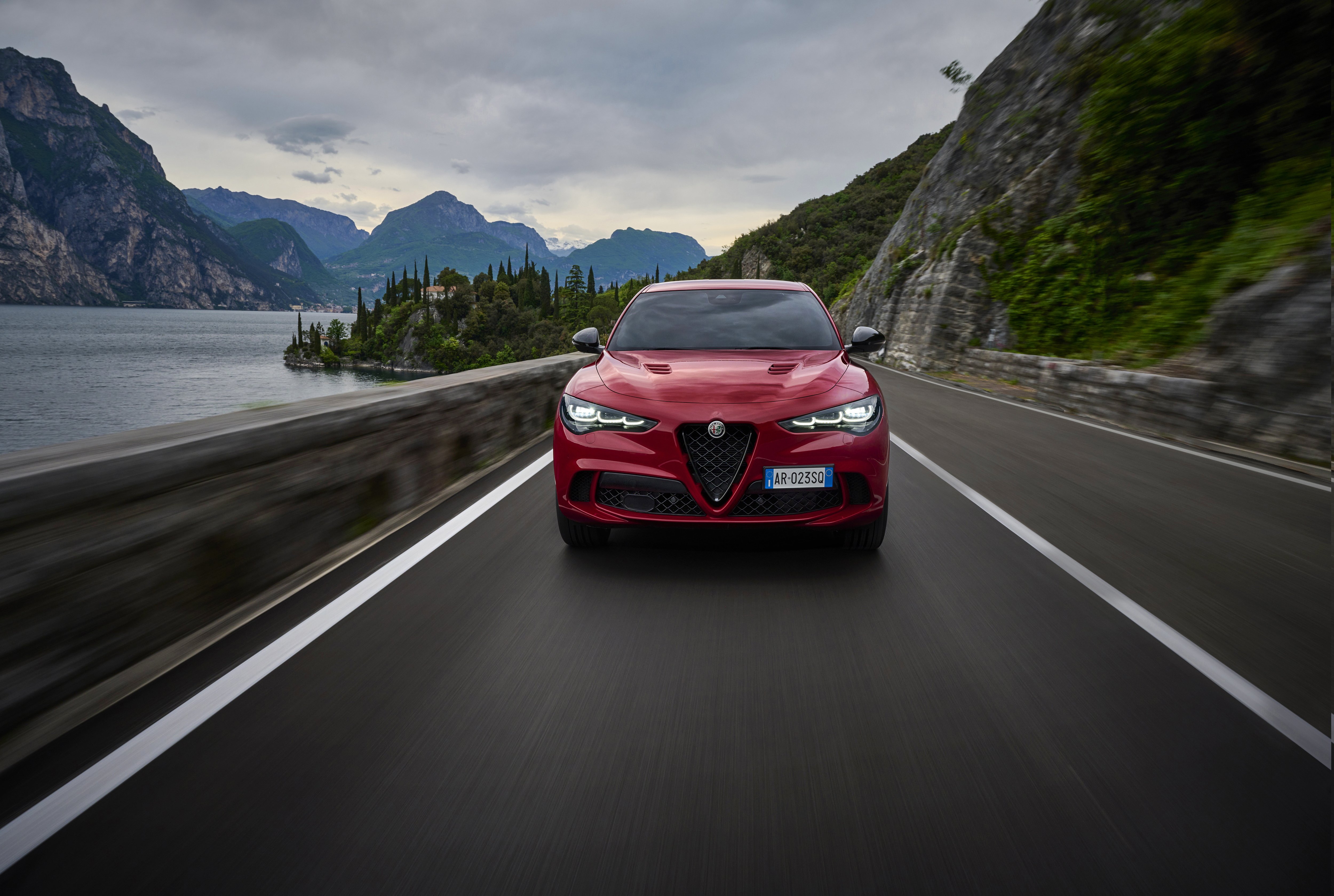 Dynamic shots of a red alfa romeo stelvio quadrifoglio