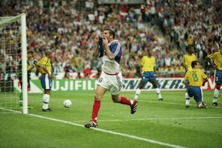Zinedine Zidane celebrates after scoring his second goal for France against Brazil in the 1998 World Cup final.