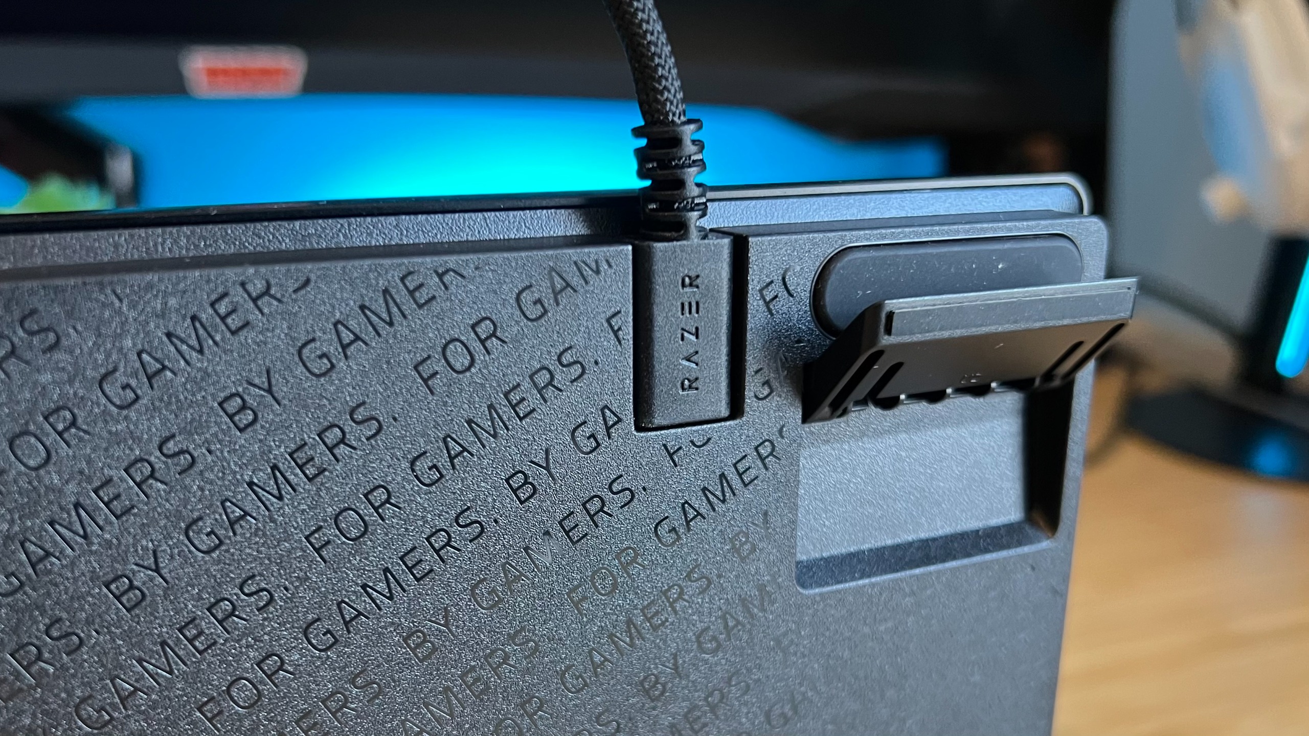 Close up on flip feet at the back of Razer Huntsman V3 HE gaming keyboard