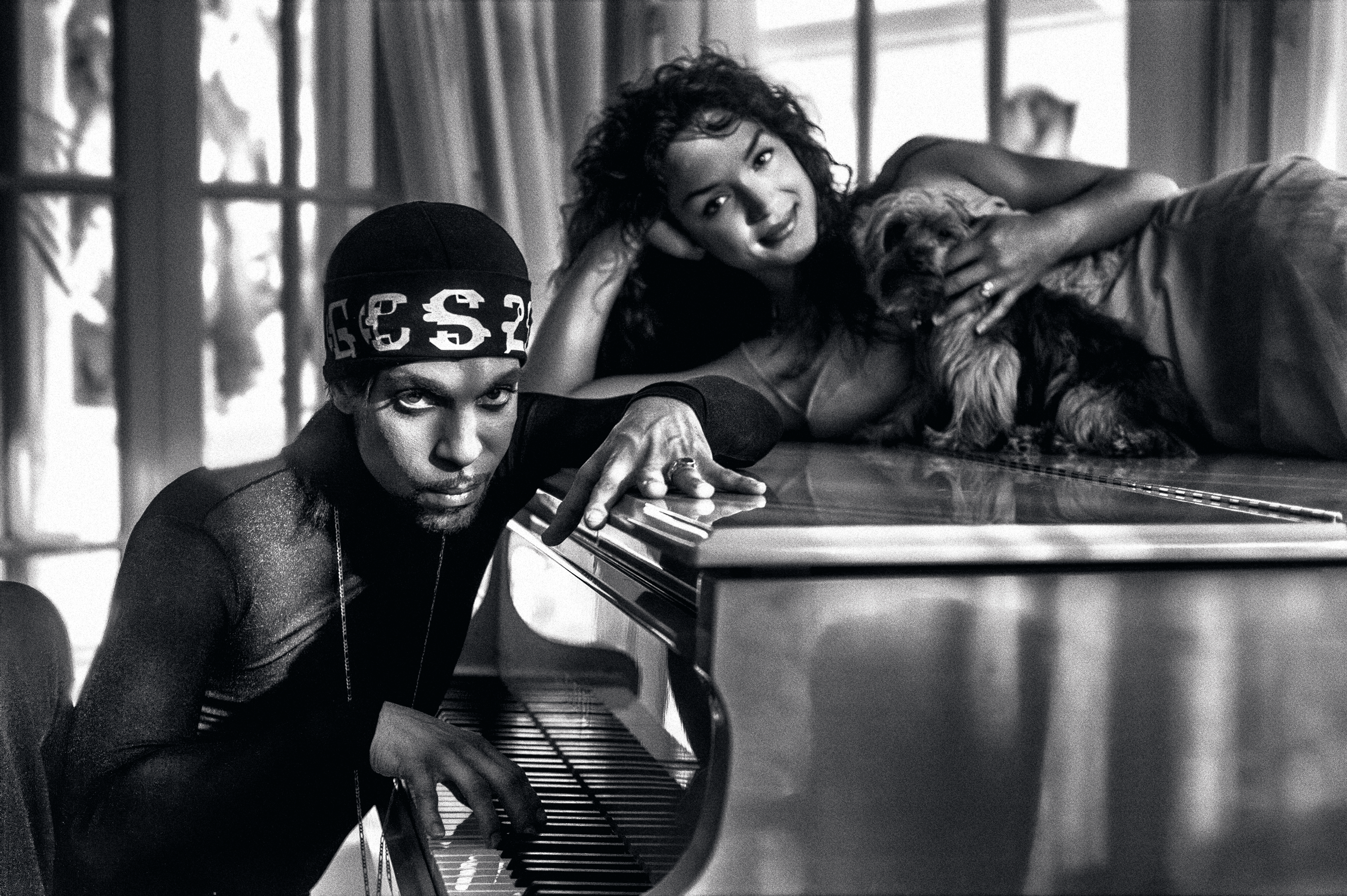 Prince and Mayte at their home in Marbella, Spain. 'Prince and Mayte with one of their dogs, Mia, posing on the piano. Mia was quite the trooper that day. I loved the light coming from all the windows and doors in this shot.'