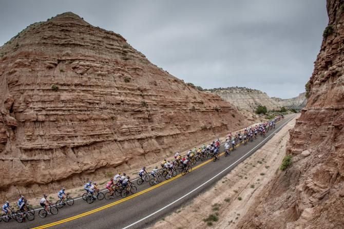 The peloton got strung out heading through red rock country