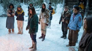 The cast of Yellowjackets season 2 standing in the snow