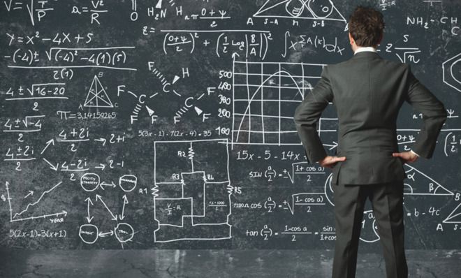 Man looking at equations