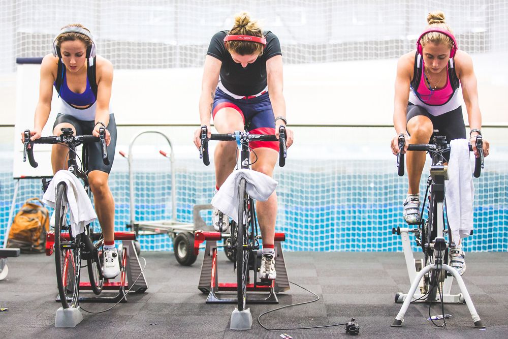 Elinor Barker, Katie Archibald, and Laura Trott warm up on the rollers