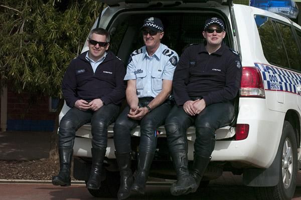 Take it easy guys: Members of the Victorian Police Force rest up during the fifth stage in Lake Boga.