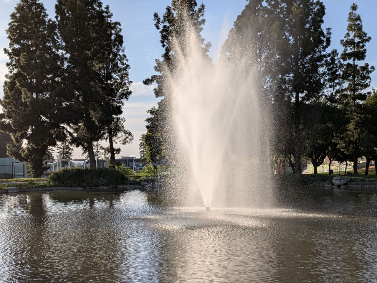 A Google Pixel 9a camera sample showing a fountain above a pond