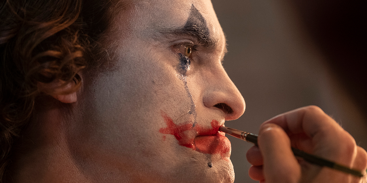 Arthur Fleck putting on his clown makeup