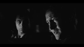 Two faces lit in a dark room from the film in cold blood