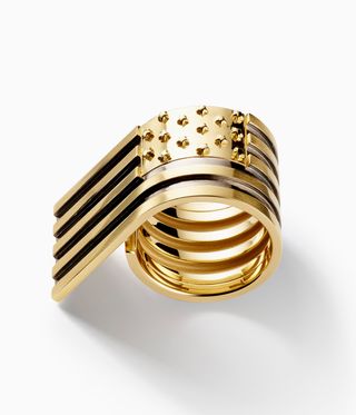 Gold ring which looks like a flag rolled round the finger