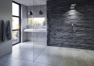 Impey wetroom with grey wall and alrge glass screen