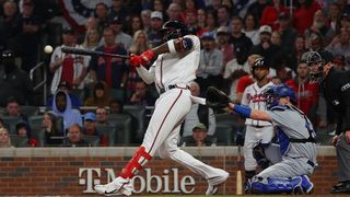 Jorge Soler #12 of the Atlanta Braves hits a double during the eighth inning of game six of the National League Championship Series against the Los Angeles Dodgers at Truist Park on Oct. 23, 2021 in Atlanta, Georgia.