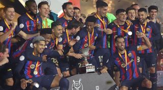 Barcelona players celebrate after winning the Supercopa de España with victory over Real Madrid in Riyadh.