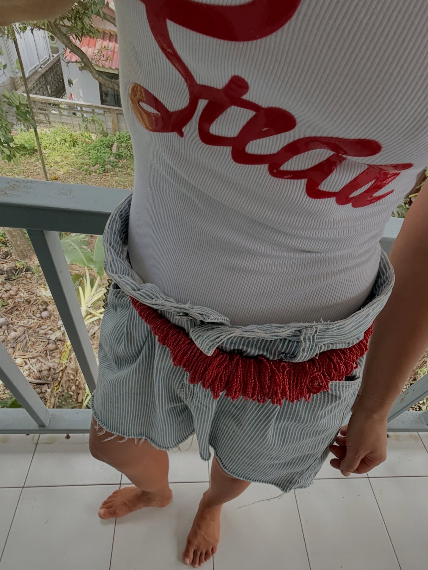 A woman wearing beaded shorts trend for summer 2026.