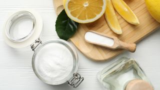 chopping board with lemon and salt to show handy kitchen cleaning hack