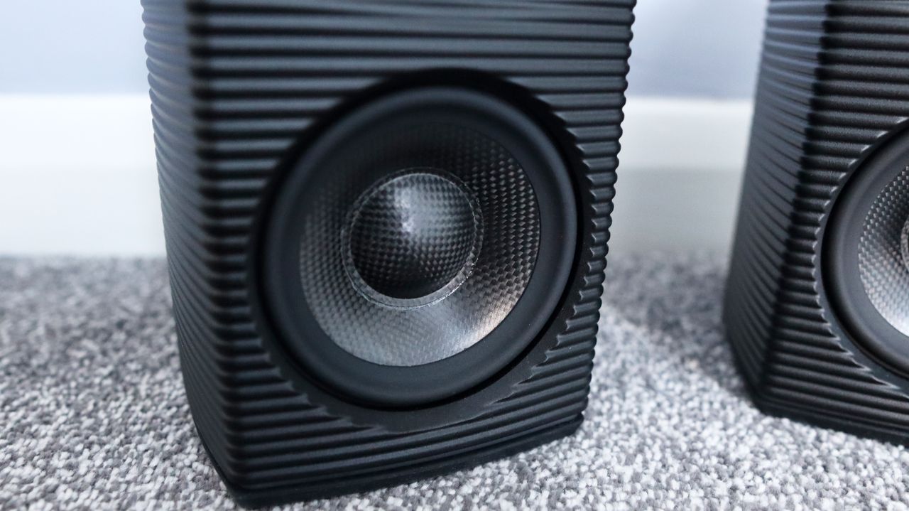 FiiO SP3 BT computer speakers set up on the floor.