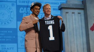 Bryce Young poses with NFL Commissioner Roger Goodell after being selected first overall by the Carolina Panthers during the first round of the 2023 NFL Draft 