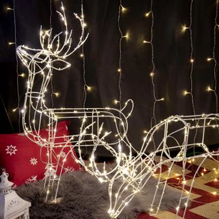 Outdoor garden furniture. Reindeer made of fairy lights