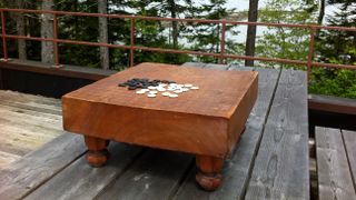 The board game Go on an outdoor table