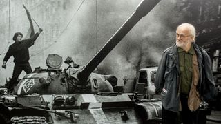 Czech photographer Josef Koudelka looks at one of the photographs in his exhibit &quot;Invasion 68 Prague&quot;, organized by the French Institute and the Czech Centre in Bucharest, to commemorate the 45th anniversary of the Soviet invasion in Czechoslovakia, on October 17, 2013. The exhibition that presents the historical moments of Prague Spring in August 1968 will run until February 2, 2014. AFP PHOTO / ANDREI PUNGOVSCHI 