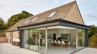 cotswold stone roof tiles and corner sliding doors