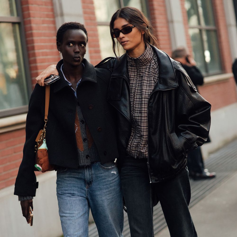 Model wears a leather bomber jacket at Milan Fashion Week