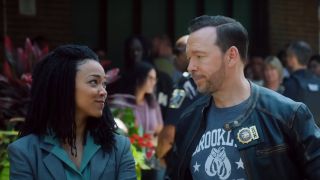 Lena Silver (Sonequa Martin-Green) and Danny Reagan (Donnie Wahlberg) look at each other in the preview for Boston Blue.