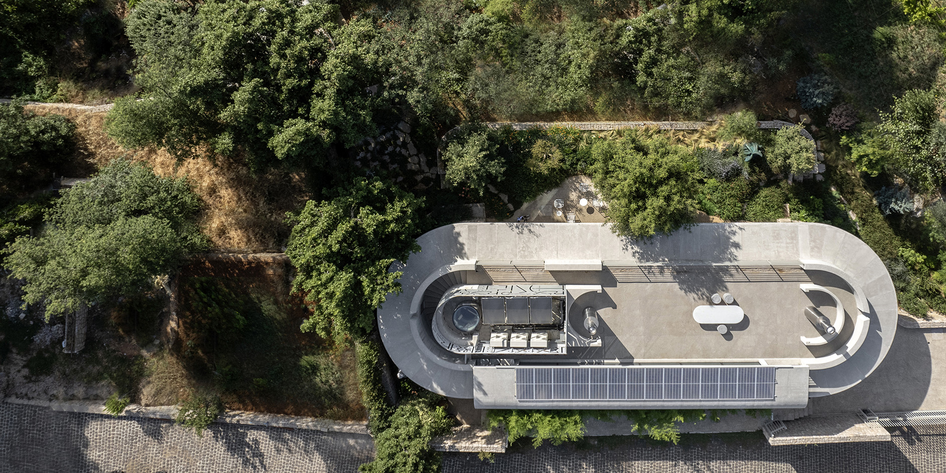 Capsule Retreat by East Architecture Studio, a concrete house in the leafy countryside with tall ceilings and minimalist interiors