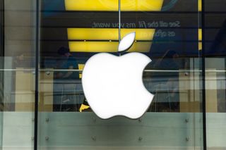 The Apple logo on a glass storefront in Ireland