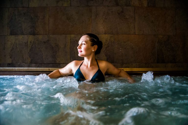 woman in a pool at a spa