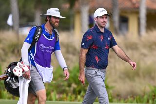 Nick Taylor and his caddie walk on the fairway during the 2023 Grant Thornton Invitational