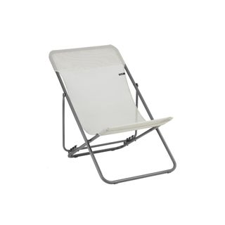 A grey metal folding deckchair