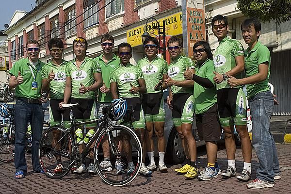 The Marco Polo Cycling team pose for a photo in Kuala Kubu Baru.