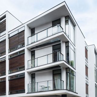 building exterior with white wall and balcony