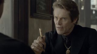 Willem Dafoe as the Devil holding a pen in Mercedes Benz ad